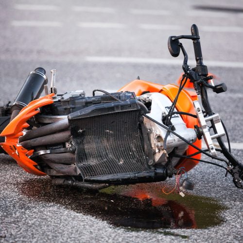 Motorcycle lying on the road after an accident